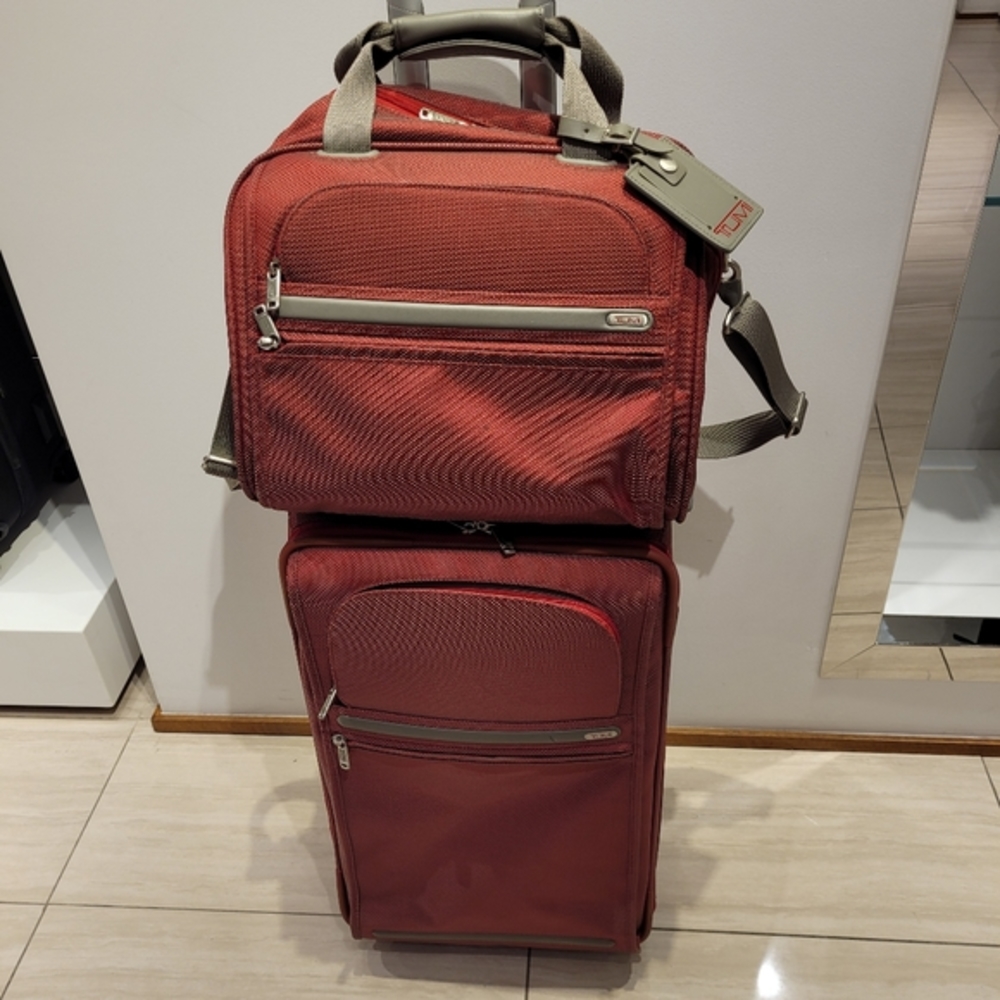 Tumi carry on and matching cosmetic tote